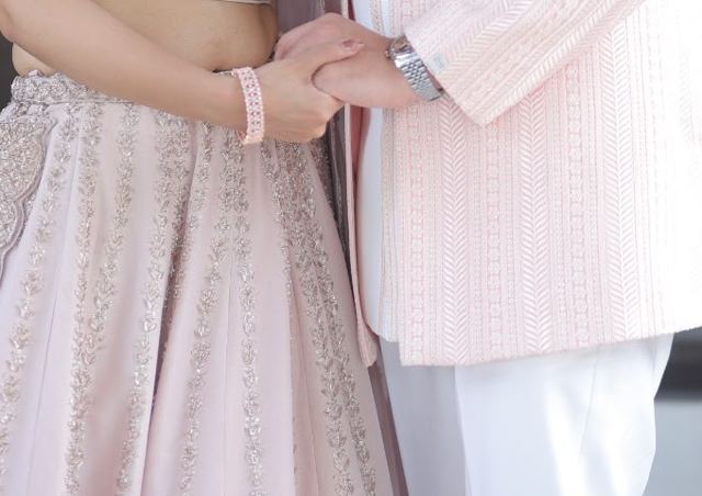 The couple holding hands, sample photo